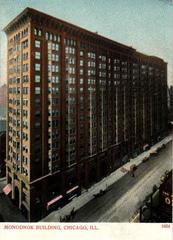 Aerial view of the historic Monadnock Building in Chicago from the intersection of Dearborn and Van Buren streets, vintage postcard style