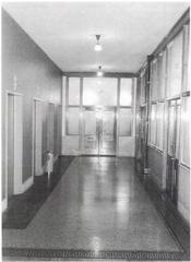 Corridor inside the historic Monadnock Building in Chicago with brick walls and arched windows