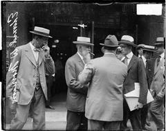 Edward W. Morrison and group of men standing in front of the Monadnock Building in Chicago