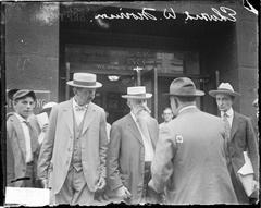 Edward W. Morrison standing with a group of men in front of the Monadnock Building Chicago in 1916