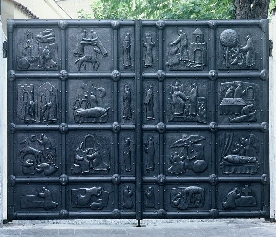 Stone arch gate entrance in historic Prague