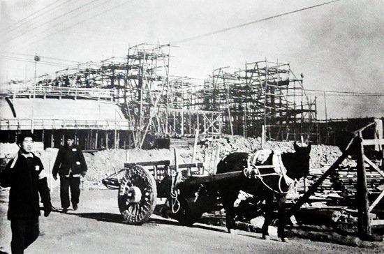 Construction site of factory 718 with cranes and building structures
