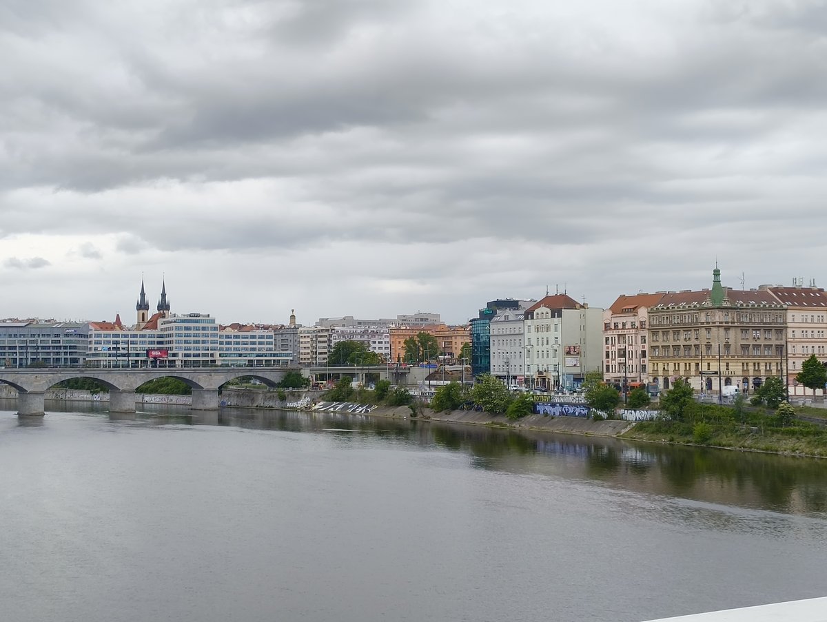 Crossing the Vltava river via Štvanická lávka footbridge in Prague