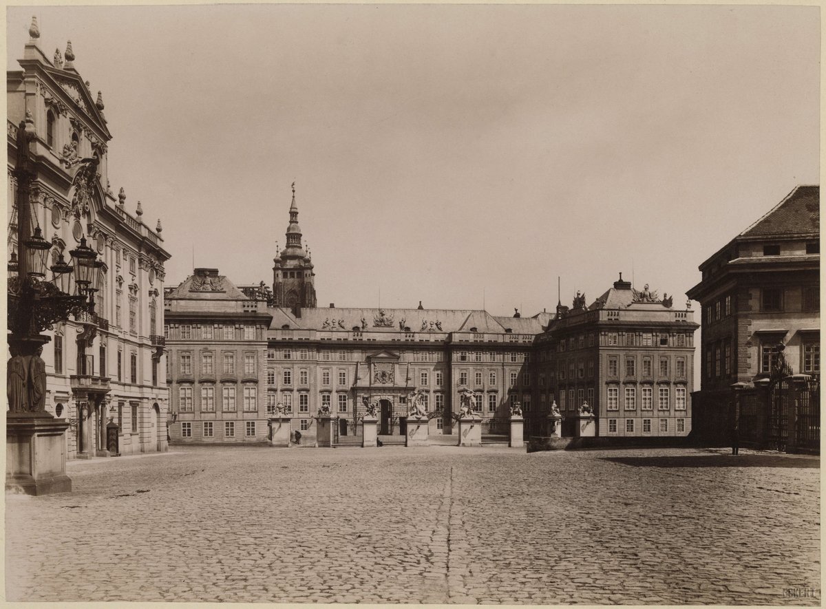 Hradčanské náměstí square with Prague Castle in the background and one tower of St. Vitus Cathedral visible