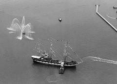 19th century sailing vessel Balclutha being pushed by a tugboat near Hyde Street Pier in San Francisco Bay