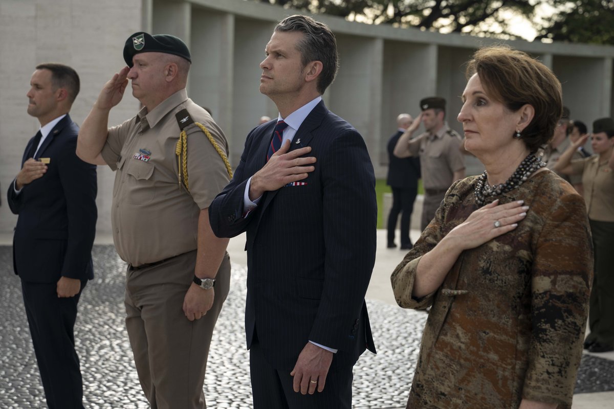 Secretary of Defense Pete Hegseth and U.S. Ambassador MaryKay Loss Carlson standing for U.S. national anthem at Manila American Cemetery Philippines March 2025