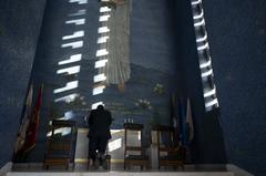 Secretary of Defense Pete Hegseth praying in chapel at Manila American Cemetery Philippines March 2025