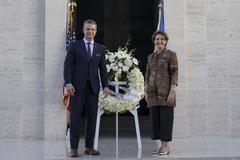 Secretary of Defense Pete Hegseth and U.S. Ambassador MaryKay Loss Carlson posing at Manila American Cemetery in the Philippines on March 28, 2025