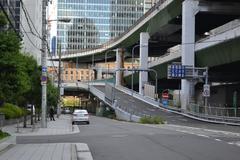 Exit of Deirubashi Bridge in Japan with traditional buildings and street signs