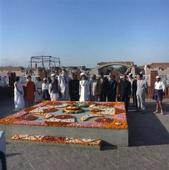 First Lady Jacqueline Kennedy observing a minute of silence at Mahatma Gandhi's Samadhi in Delhi