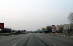 Kyiv Ring Road with highway and vehicles under clear sky