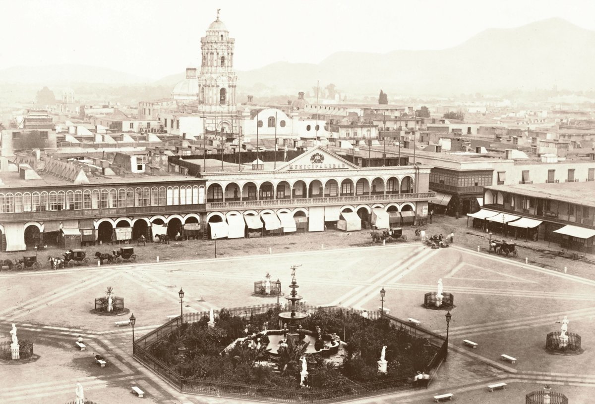 Historical reconstruction photograph of Plaza de Armas in Lima in 1865 showing colonial architecture and people in period attire