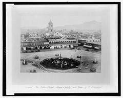 Public square with Municipality building and tower of St. Domingo in Lima