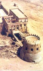 Aerial view of one of the towers of Daryan Castle with the palace behind it