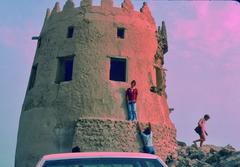 Group of tourists in front of Darin Castle tower before its collapse