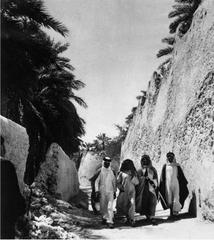 Sur Wall of Qatif Castle with Local People Walking Beside It