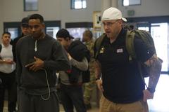 U.S. Army active duty and veteran soldiers waiting to collect luggage at El Paso International Airport