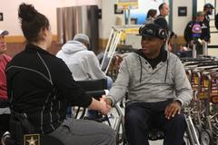 U.S. Army active duty and veterans greeting at El Paso International Airport with luggage