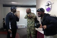 U.S. Army Sgt. 1st Class Michael Smith joking with fellow wounded warriors at El Paso International Airport during Army Trials reception