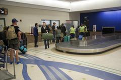 U.S. Army active duty and veteran athletes picking up luggage at El Paso International Airport during Army Trials at Fort Bliss 2016