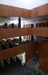 Library interior of Free University of Bozen-Bolzano with bookshelves and seating areas