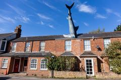 The Headington Shark sculpture mounted on a rooftop in Oxfordshire, UK