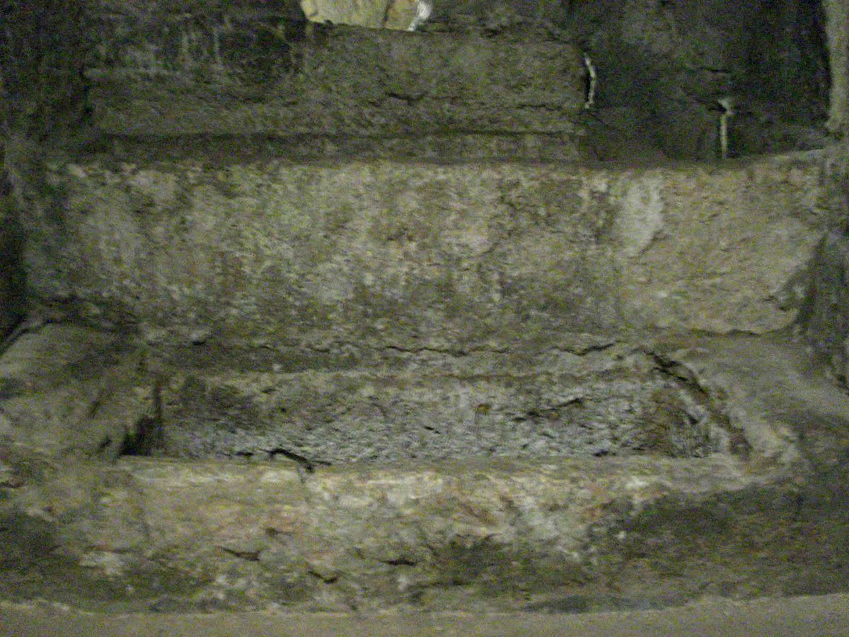 Eusebio Papa Tomb in San Giovanni Catacombs with ancient stone architecture and carved inscriptions