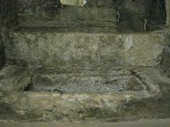 Eusebio Papa Tomb in San Giovanni Catacombs with ancient stone architecture and carved inscriptions