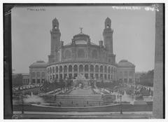 Historic black and white photo of the Trocadero in Paris with crowds and vintage vehicles