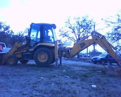 Entrance of Nixticuil Forest with SIAPA JCB 214 backhoe loader machinery