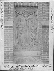 Limestone relief at the west portal of Västerås Cathedral featuring John the Baptist and Saint David, from the 1500s