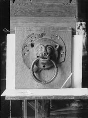 Close-up of a door knocker at Västerås Cathedral showing intricate metalwork detail