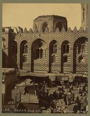 Close-up detail of the ornate façade of the Sultan Kalaoun Mosque in Cairo showcasing intricate Islamic architectural design