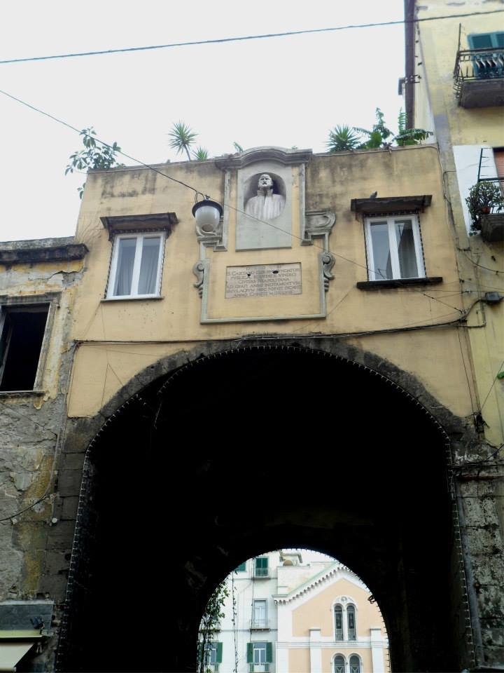 Porta Nolana ancient city gate with brick and stone architecture in Naples, Italy