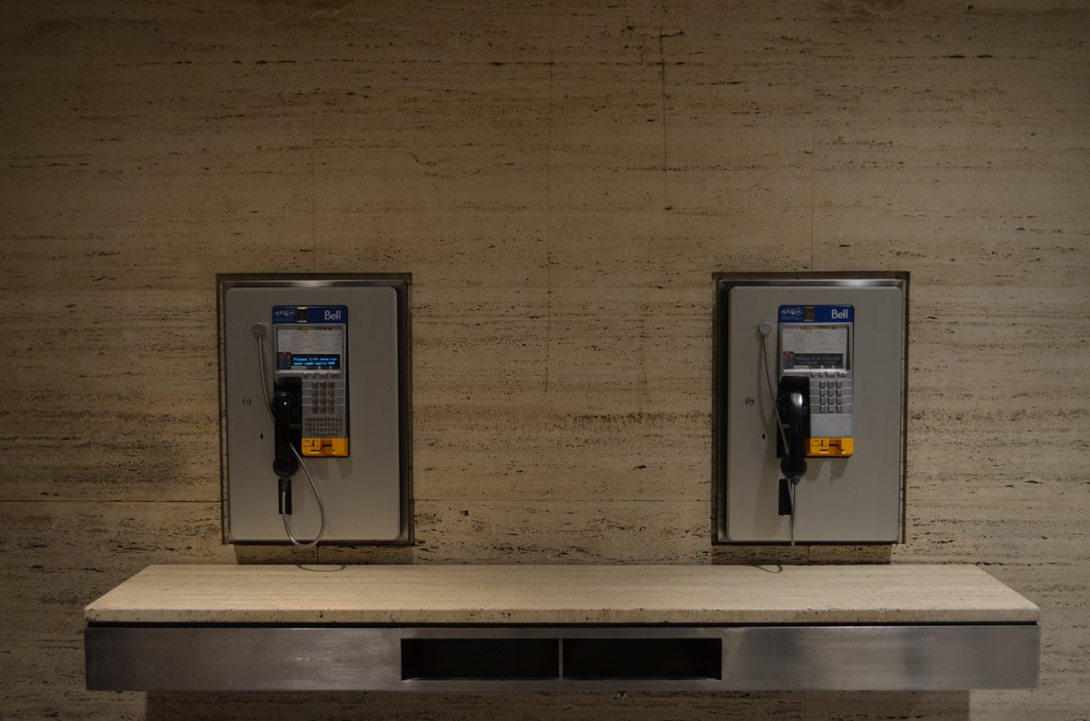 Bell branded pay phones in a food hall