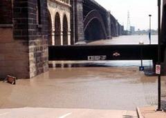 Eads Bridge during the Flood of 1993 with high water level and flooding around the structure