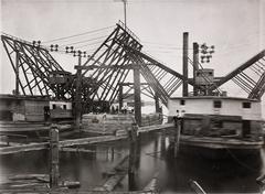 Historical black and white photograph of Eads Bridge construction showing the sinking of the east pier in the river