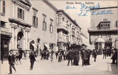 Street view of Strada Reale in Valletta, Malta showing historical buildings and vintage postcard style