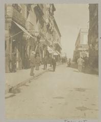 Early 20th century photograph of Strada Reale street in Valletta showing cityscape with people and buildings