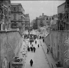 British Army in Malta 1942 showing bomb damage on Kingsway from Porta Reale with ruins of Opera House