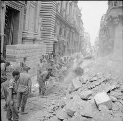 British Army soldiers clearing bomb damage with picks and shovels on Kingsway in Valletta, Malta, 1942