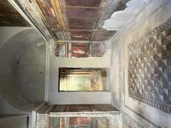 Interior view of the Villa of the Mysteries in Pompeii with ancient frescoes on walls