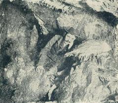 Entrance of Pál-völgy Cave surrounded by rocky terrain and sparse vegetation