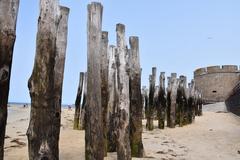 Saint-Malo beach with sandy shore and stone walls