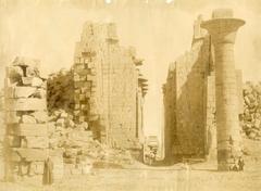 Entrance to the Great Hypostyle Hall of Karnak Temple Complex with large columns and locals for scale
