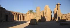 Grand courtyard of the Temple of Amun-Re at Karnak with ancient Egyptian columns and obelisks