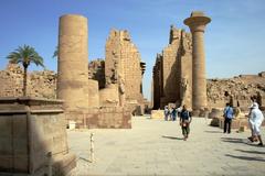 Middle courtyard of Karnak temple complex near Luxor Egypt with ancient stone columns and blue sky