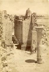 First courtyard of Karnak Temple Complex with second pylon and Great Hypostyle Hall including Taharqa's kiosk column seen from first pylon