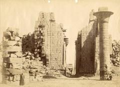 Entrance to the Great Hypostyle Hall of Karnak Temple complex with column of Taharqa and locals
