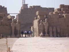Karnak Temple Complex in Luxor Egypt showing ancient monumental columns and ruins under blue sky